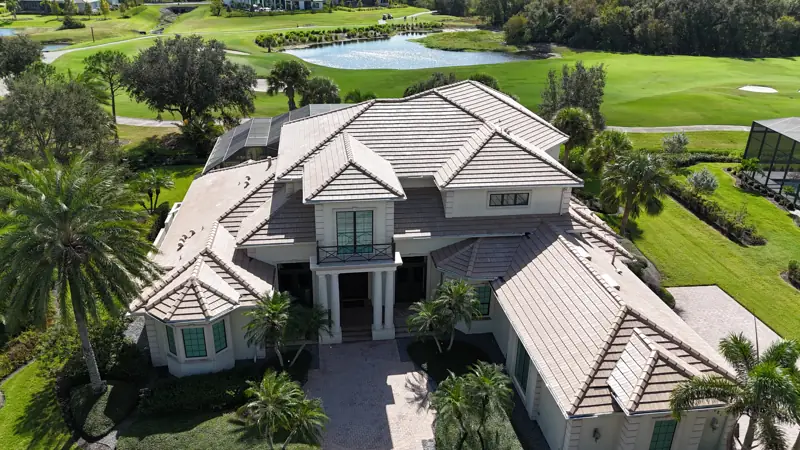 Aerial view of a new flat concrete tile roof completed by Epoch Roofing in Sarasota, FL